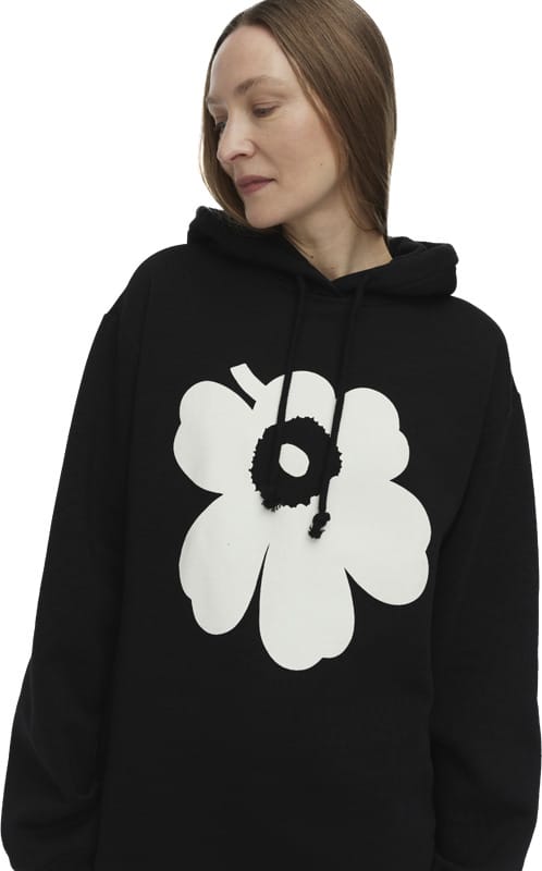 Runoja Unikko -huppari. Vahvoja kuvioita, rentoa käytännöllisyyttä.